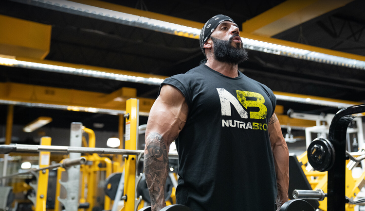 Man lifting weights at the gym .