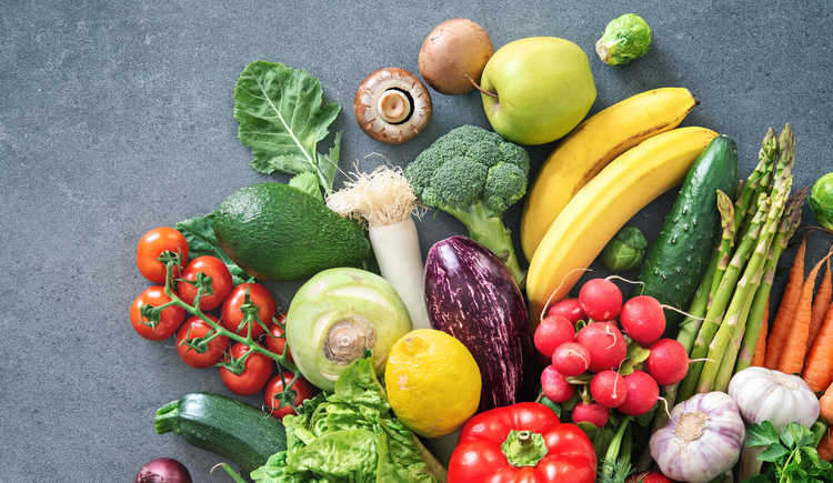 Various fresh fruits and vegetables laid together.