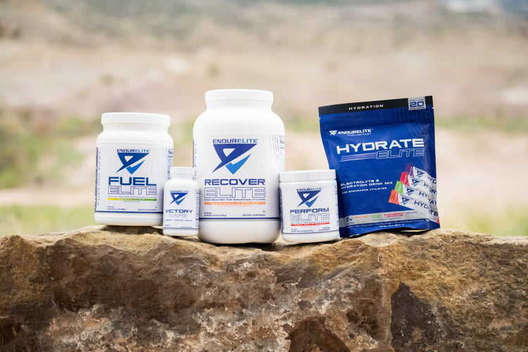 Containers of Fuel Elite, Victory Caps, Recover Elite, Perform Elite, and Hydrate Elite supplements.