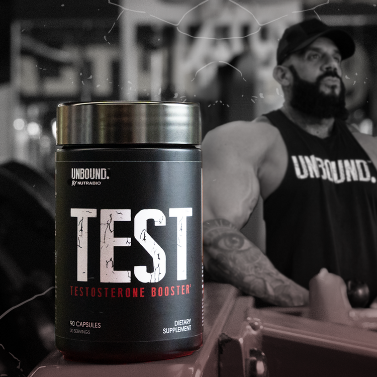 A black tub of NutraBio's Unbound "Test" testosterone boost supplement, with a man in a tank top flexing in the background.