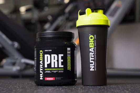 Bottle of NutraBio PRE workout supplement and a shaker cup.
