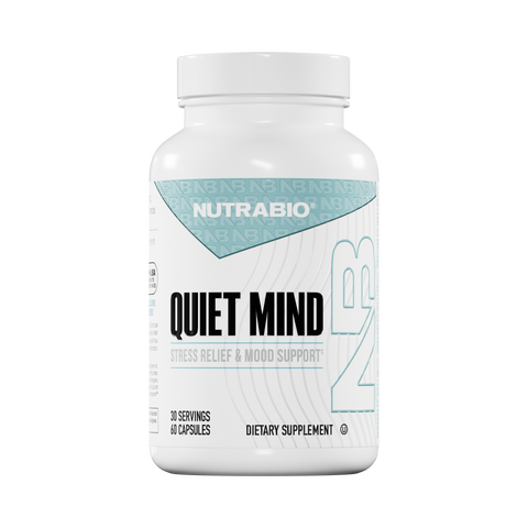 A white bottle of NutraBio Quiet Mind dietary supplement with blue and black text, promoting stress relief and mood enhancement. The label indicates 60 capsules (30 servings).