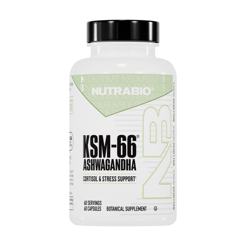 A white bottle of NutraBio Ashwagandha KSM-66 features a green and black label, offers 60 capsules (60 servings), and supports cortisol and stress reduction with premium KSM-66 ashwagandha root extract.