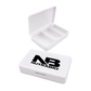 A white plastic pill organizer box shown in two views: one open with three compartments and one closed featuring a large black 'NB NUTRABIO' logo on the lid, set against a plain white background.