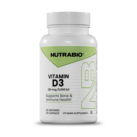 A white bottle of Nutrabio Vitamin D3 dietary supplement with a white cap, featuring a green and white label.