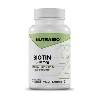 A white bottle of Nutrabio Biotin 5,000 mcg vitamin supplement with a white cap, shown on a clean white background.