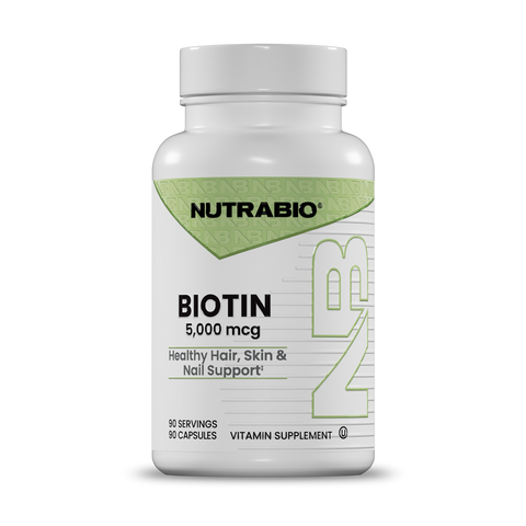 A white bottle of Nutrabio Biotin 5,000 mcg vitamin supplement with a white cap, shown on a clean white background.