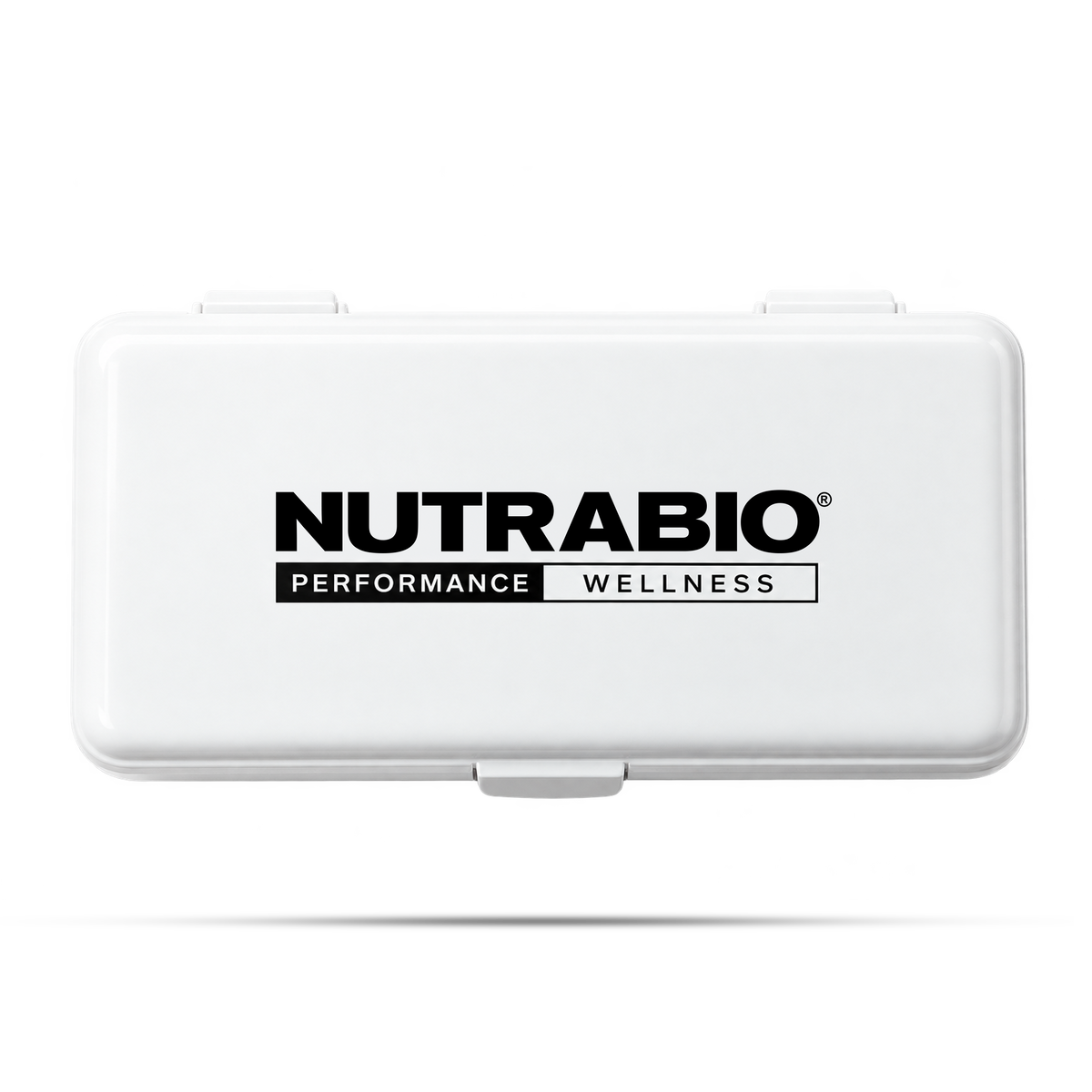 White rectangular Weekly Pill Organizer with the Nutrabio Performance Wellness logo printed on the lid, serving as a convenient travel pill box.