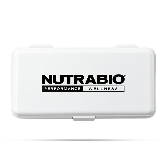 White rectangular Weekly Pill Organizer with the Nutrabio Performance Wellness logo printed on the lid, serving as a convenient travel pill box.